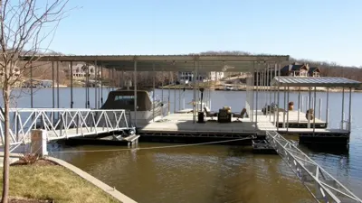 Covered residential dock connected by a metal gangway