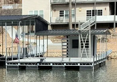 Covered dock with an American flag and an enclosed storage room
